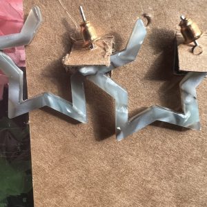 Acrylic Star shaped earrings grey colour