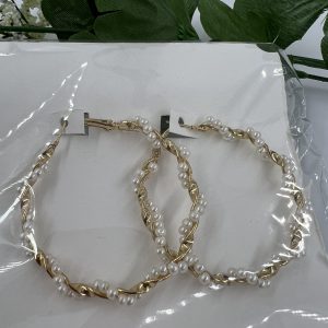 Large gold plated hoop earrings with costume pearl twist