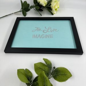 Black framed picture with saying