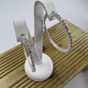 Large silver plated earrings set with rhinestones