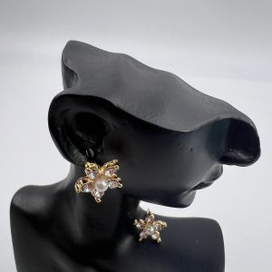 Ornate flower shaped stud earrings set with faux pearls glamorous look 1piece- Colour gold