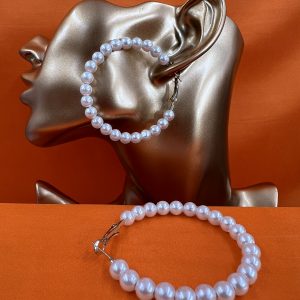 Large hoop earrings set with faux pearls