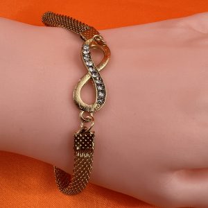 Vintage design bracelet with bow shaped design set with gemstones