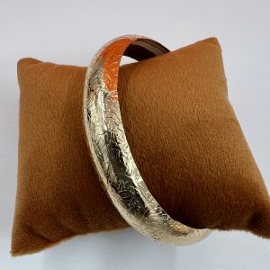 Bangle with decorative design