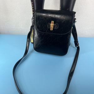 Black shoulder cross body bag with design