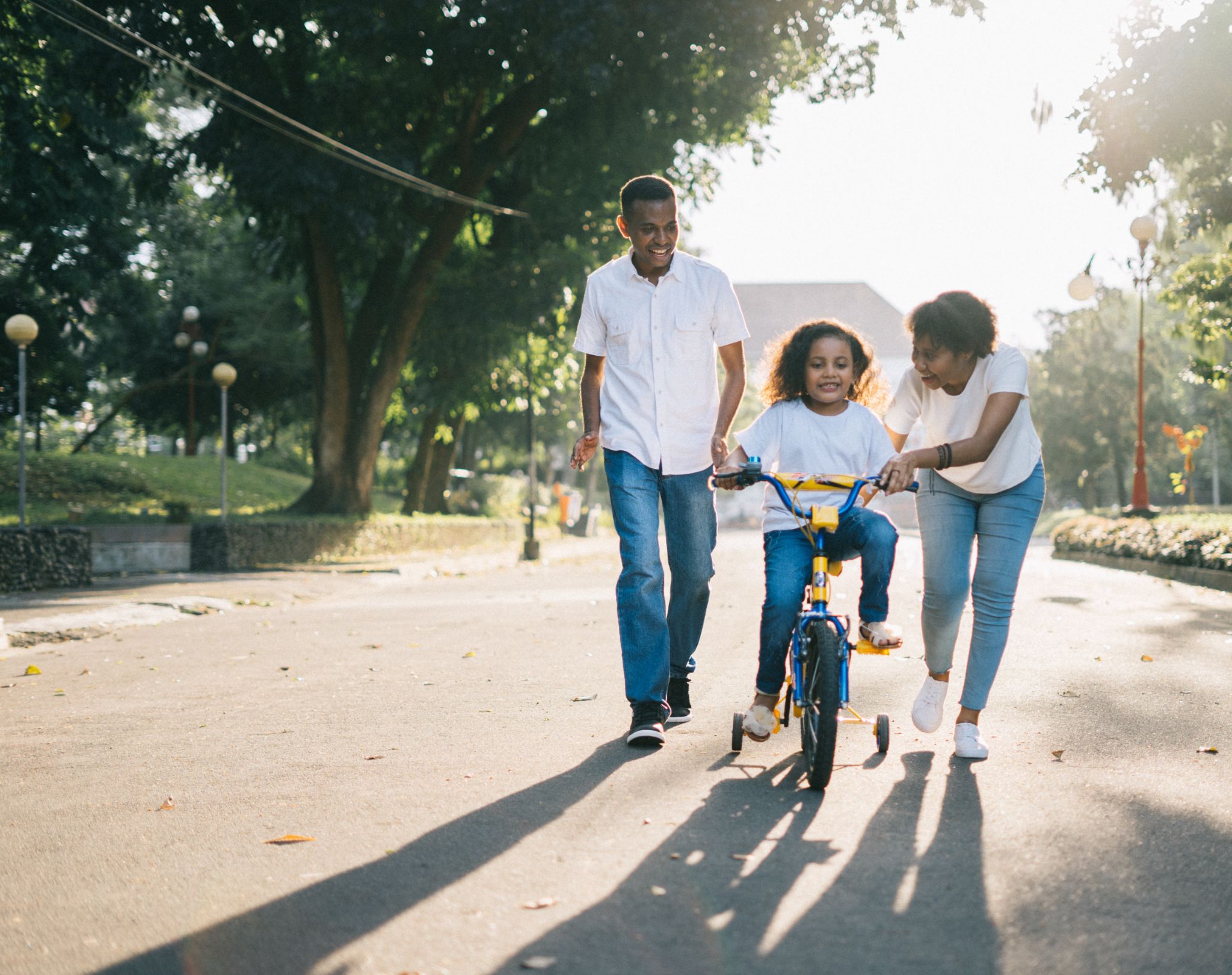 a child learning how to ride a bicycle